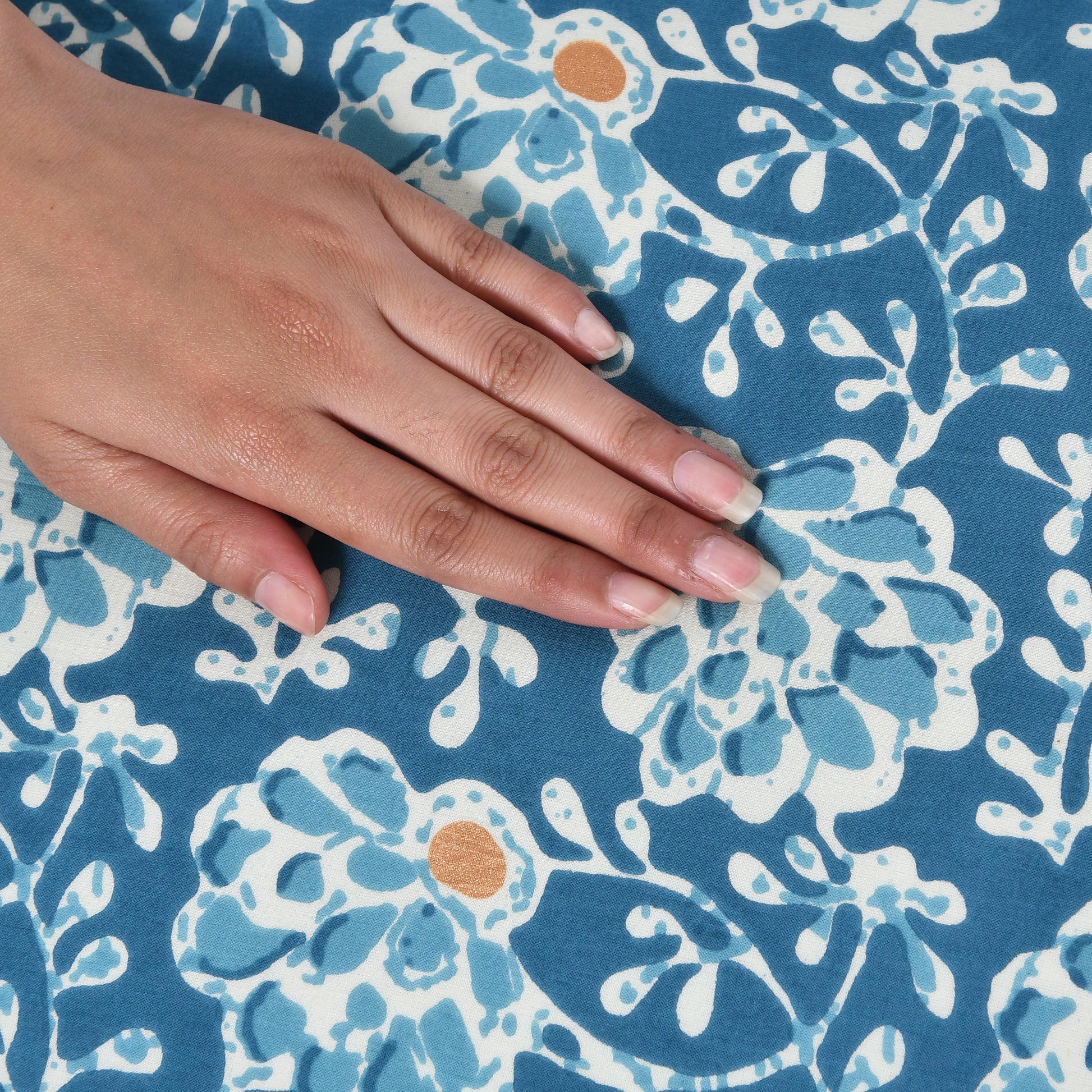 Detail of handcrafted block print on cotton boho pillow cover