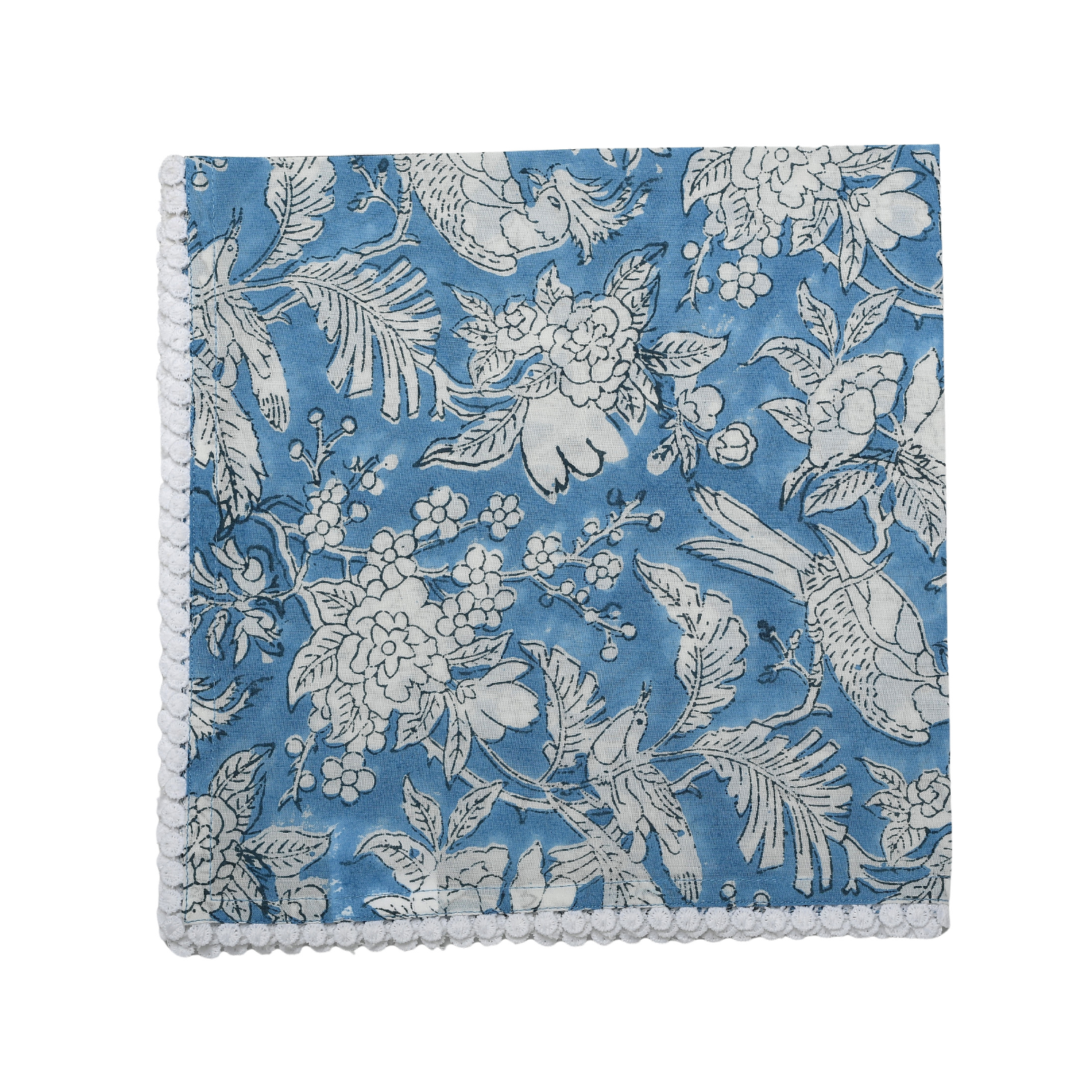 Single flat lay of blue and white floral cotton napkin.