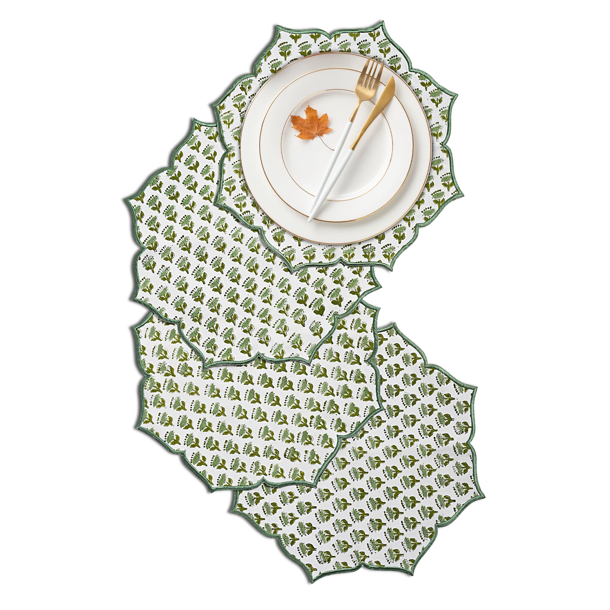 Emerald embroidered placemat styled with gold flatware