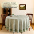 a round table with a green tablecloth on it