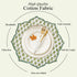 Emerald embroidered placemat styled with gold flatware
