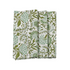 A set of folded cotton cloth napkins with a green floral pattern on a white background.