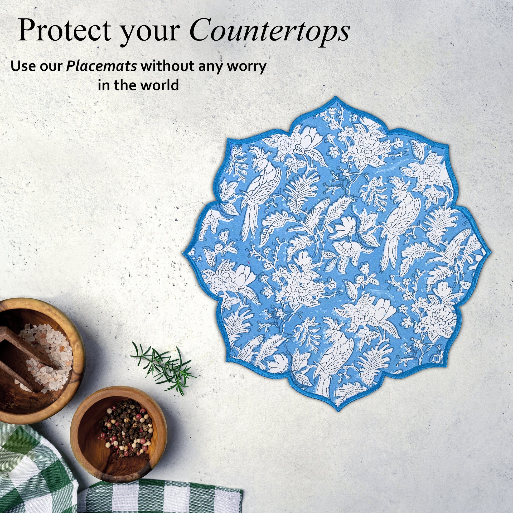 Close-up of embroidery on bold blue cotton placemat hand block printed