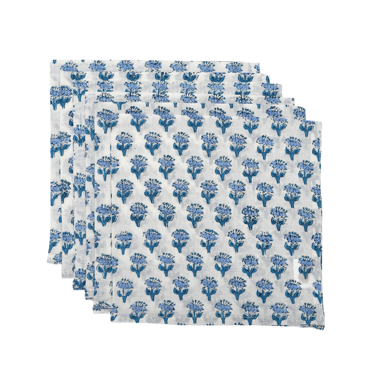Set of six blue and white floral cloth napkins fanned out on white surface.