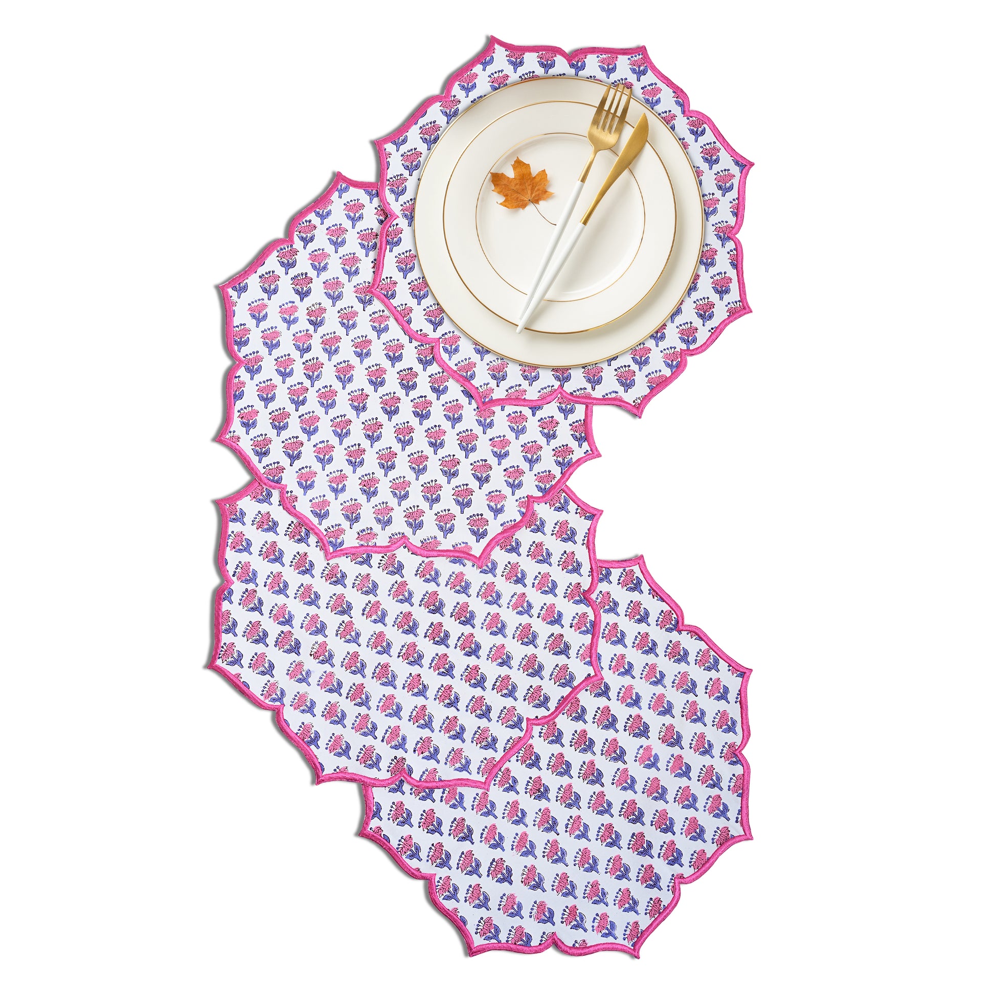 Deep pink placemat paired with gold utensils