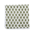 Single flat lay of green and white floral cotton napkin.