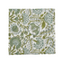 Green botanical block-printed cotton napkin in close-up.