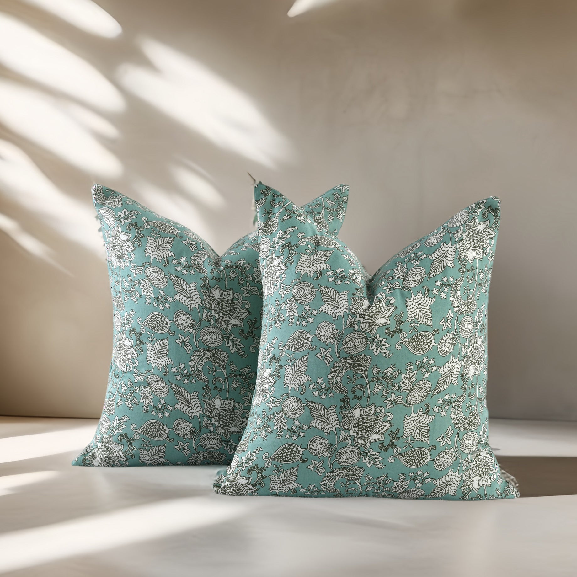 Artisanal boho-style pillow covers with intricate patterns and soft cotton texture