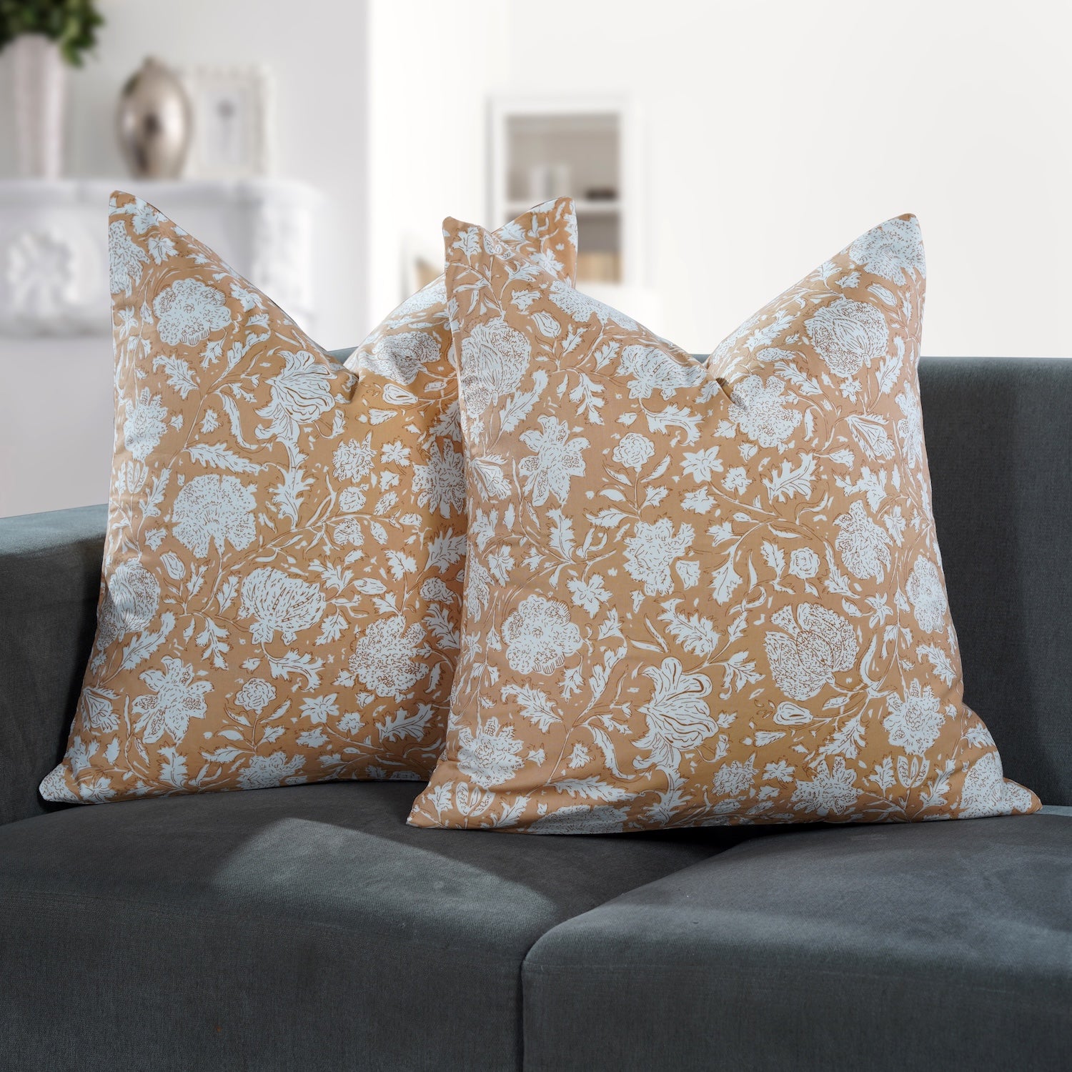 Set of 2 boho pillow covers displayed on neutral couch