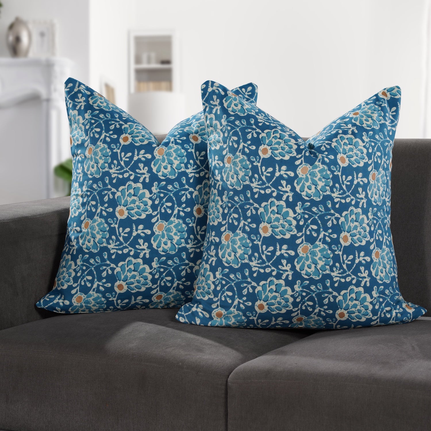 Set of 2 boho pillow covers displayed on neutral couch