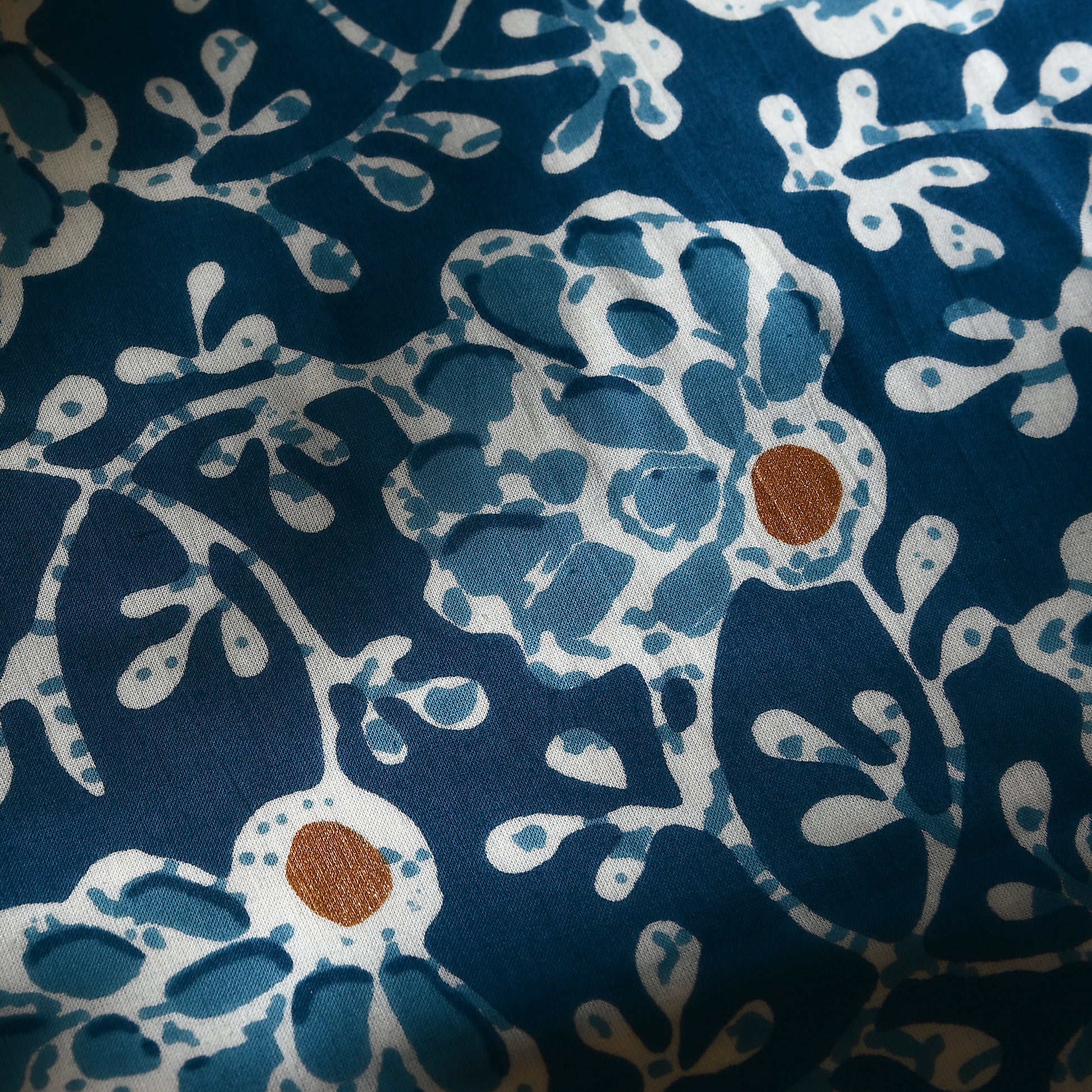 Detail of handcrafted block print on cotton boho pillow cover