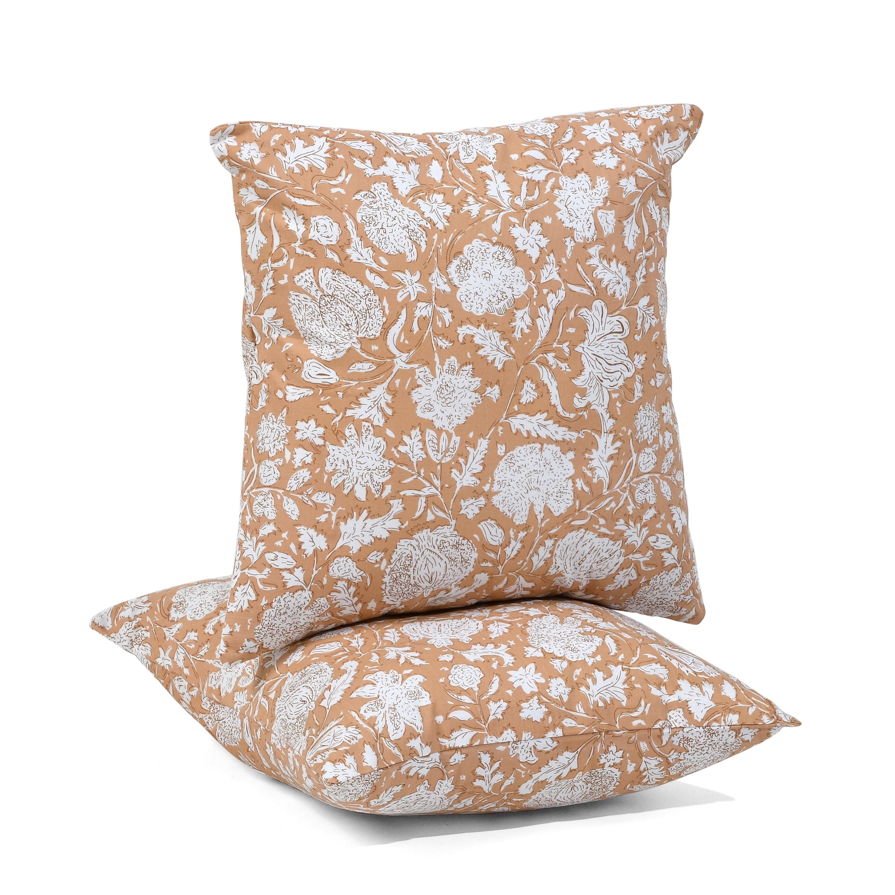 a pair of pillows sitting on top of each other