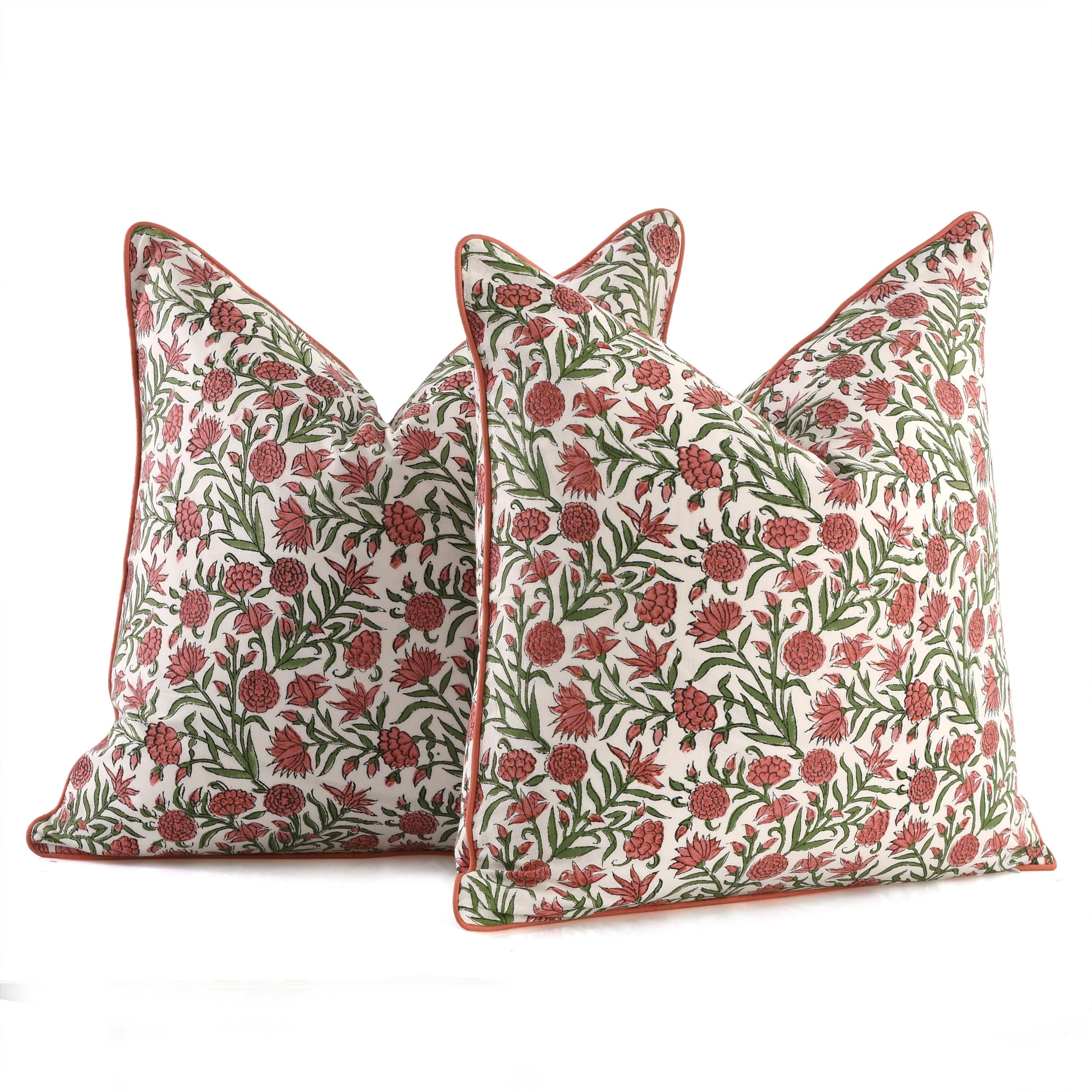 Hand-block printed red and green cushion with refined piping