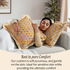Woman relaxing on a couch with two bohemian floral pillows for comfort and cozy home décor