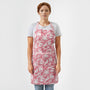 lady wearing a pink and white floral cotton block print kitchen apron