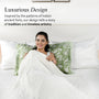 Woman wrapped in a blanket on a bed with decorative pillows, text about luxurious design inspired by India's ancient forts.