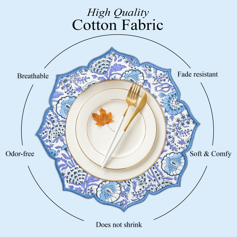 Dramatic tablescape with deep blue embroidered placemat
