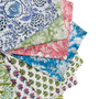 Fan arrangement of folded colorful floral napkins, fanned out in a spiral.


