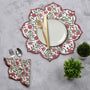 red and green floral Garnet-toned cotton placemat styled with neutral plates