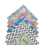 Stack of block-printed napkins in assorted colors with patterned edges.

