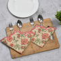 Bold orange embroidered placemat with scalloped edge
