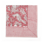 pink botanical block-printed cotton napkin in close-up.


