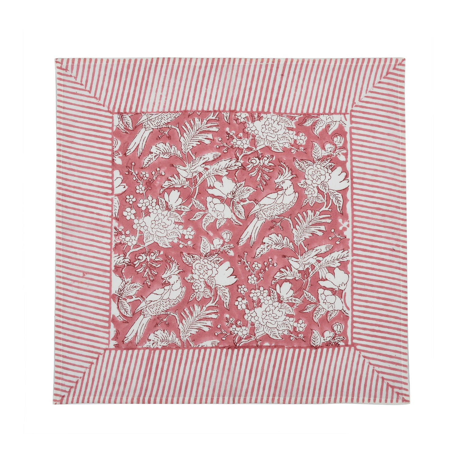 pink botanical block-printed cotton napkin in close-up.

