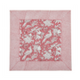 pink botanical block-printed cotton napkin in close-up.

