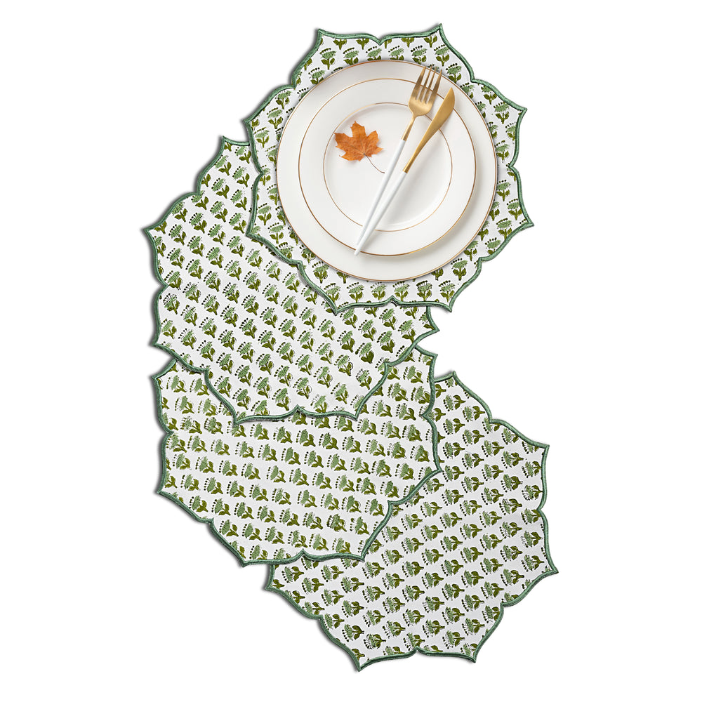 Emerald embroidered placemat styled with gold flatware