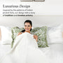 Woman on a bed with decorative pillows and bedding, text about luxurious design inspired by India's ancient forts.