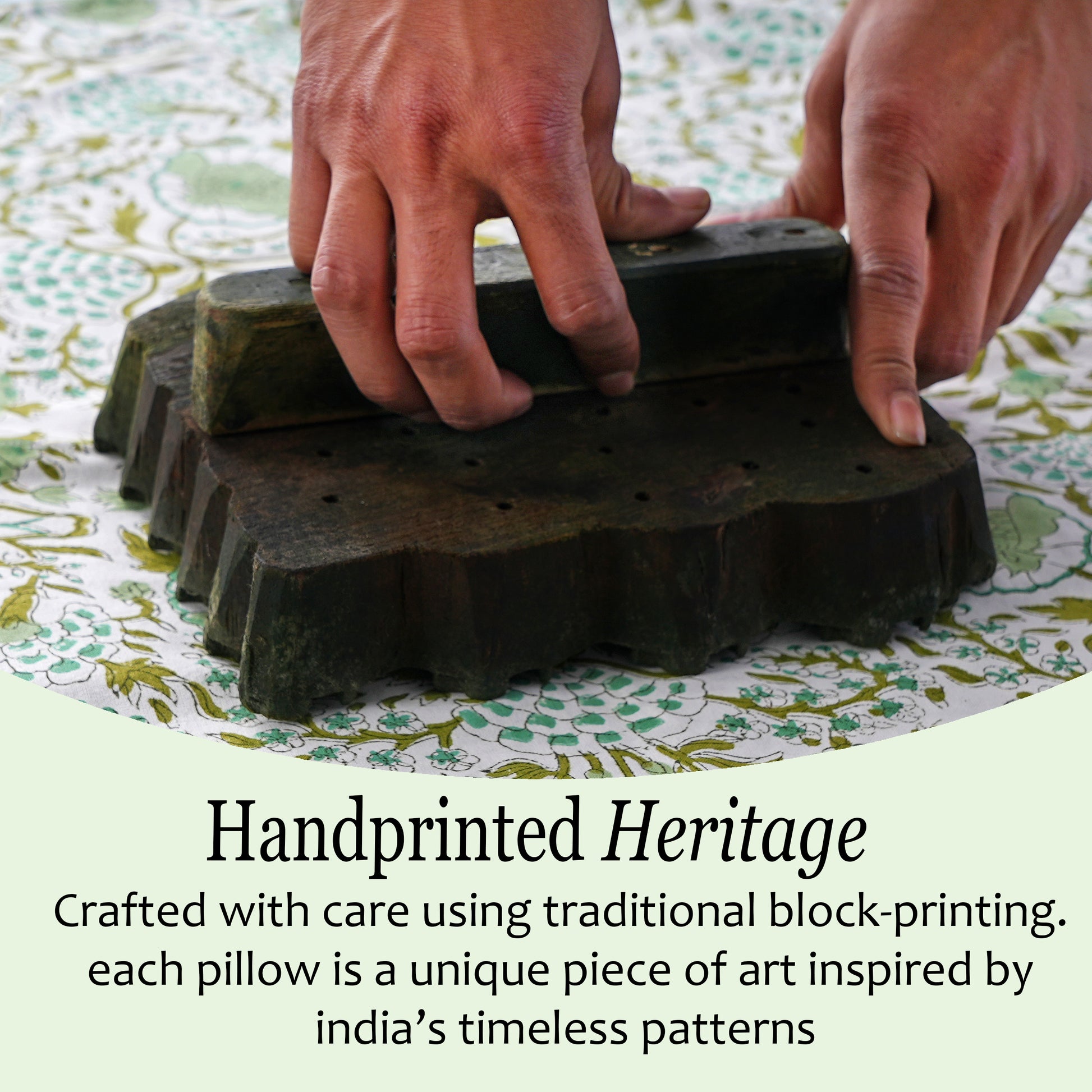 Hand printing a pillow with traditional block-printing technique on a patterned fabric background.
