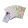 A set of six cotton cloth napkins in various floral and geometric prints, displayed on a white background.