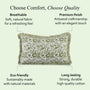 Decorative pillow with text highlighting comfort, quality, eco-friendliness, and durability on a light green background.