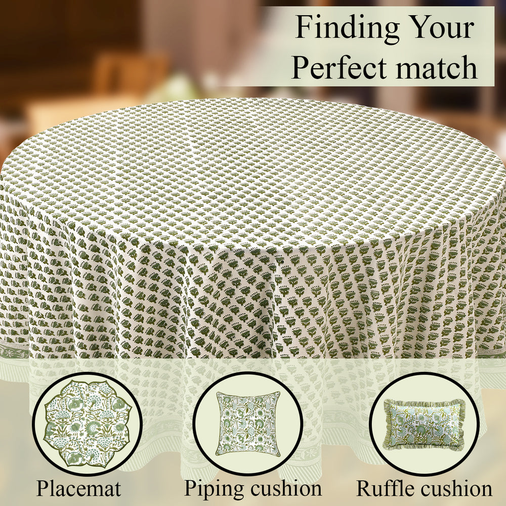 a round table with a green tablecloth on it
