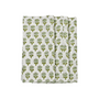 A set of folded emerald green cotton cloth napkins with a floral block print design on a white background.