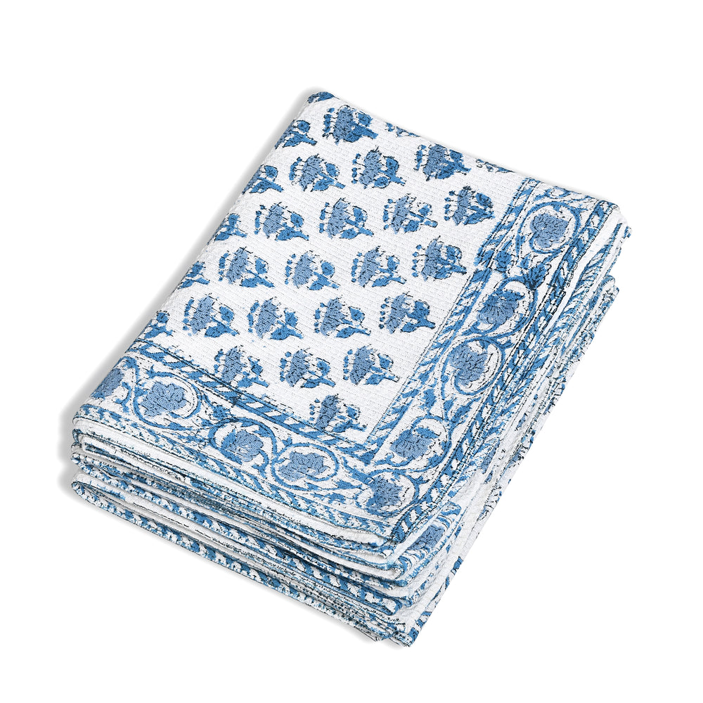Set of three folded Apatite Blue waffle cotton towels with floral hand block print
