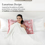 Woman lying on a bed with decorative pillows, surrounded by text about luxurious design inspired by India's ancient forts.