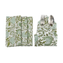 Six green floral napkins displayed in a fan arrangement with a single folded one in the center holding silverware