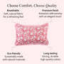 Pink decorative pillow with white patterns on a white background, featuring text about comfort, quality, eco-friendliness, and durability.