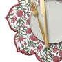 Close-up of red and green floral embroidered scalloped edge