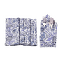 Six blue floral napkins displayed in a fan arrangement with a single folded one in the center holding silverware.
