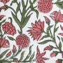 Close-up of red and green floral embroidered scalloped edge