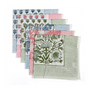 Stack of block-printed striped napkins in assorted colors with patterned edges.