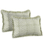 Two green and white textured pillows on a white background