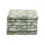 Stack of neatly folded green floral napkins on a white background.