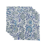 Set of six blue and white floral cloth napkins fanned out on white surface.