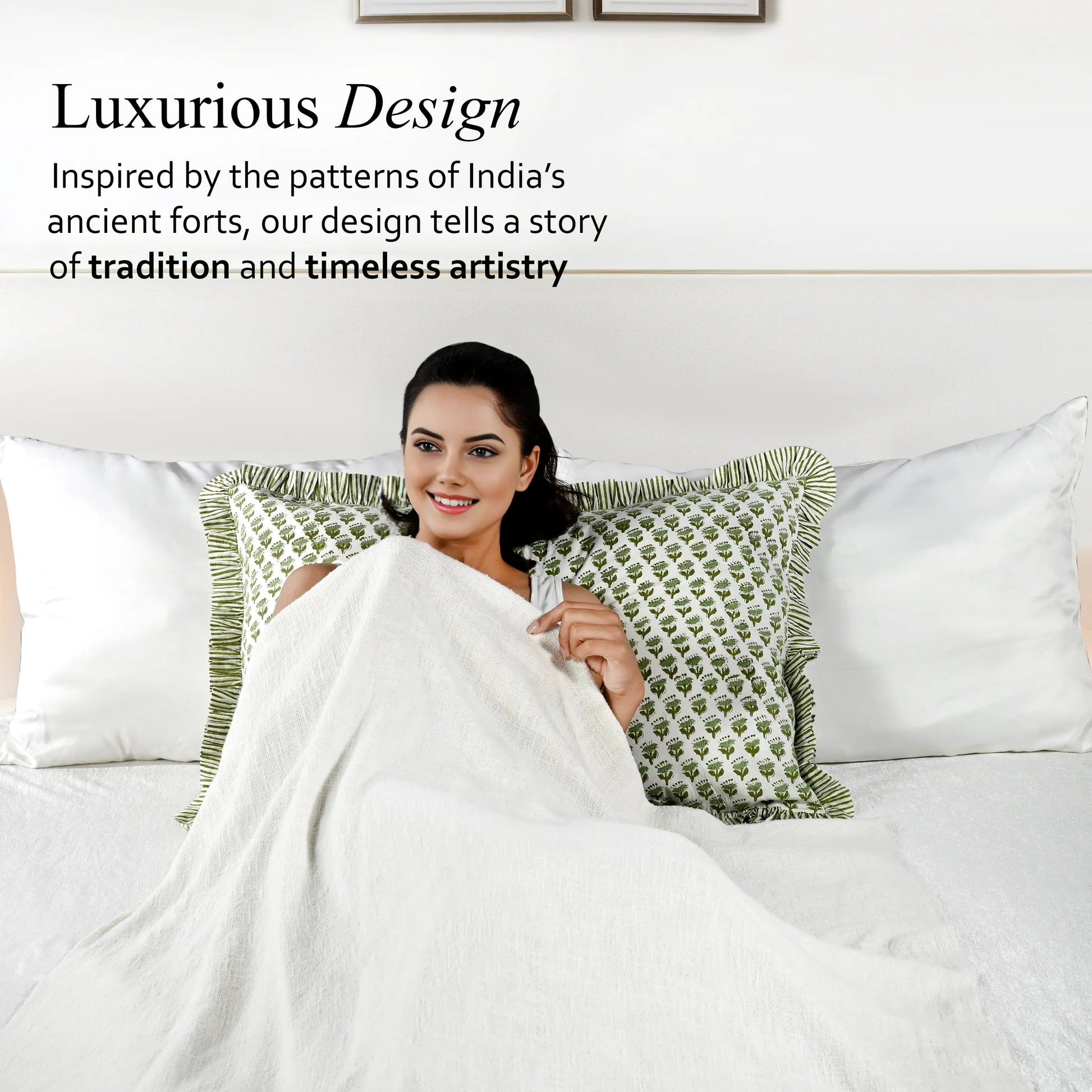 Woman wrapped in a white blanket with green patterns on a bed, text about luxurious design inspired by India's ancient forts.