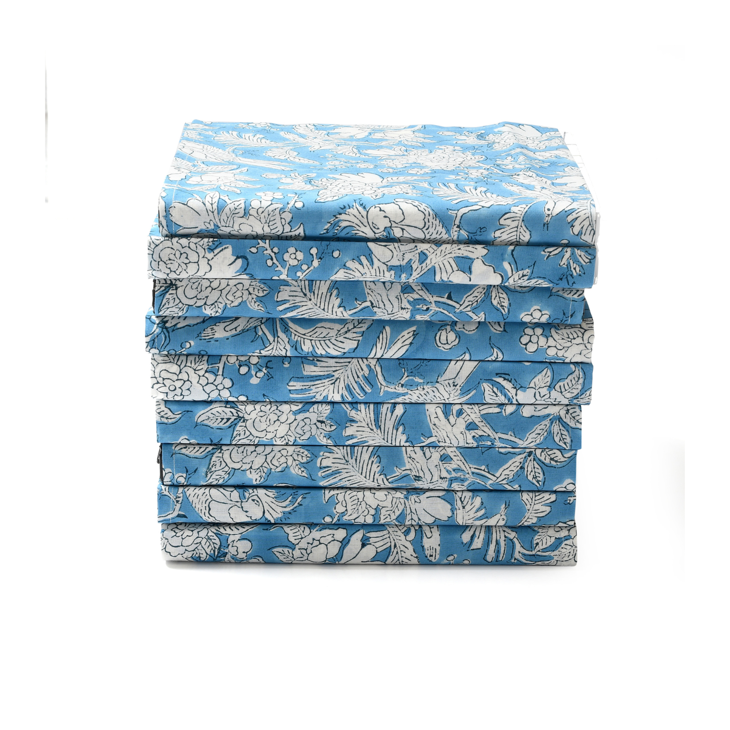 Stack of neatly folded blue floral napkins on a white background.

