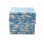 Stack of neatly folded blue floral napkins on a white background.

