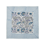 blue botanical block-printed cotton napkin in close-up.

